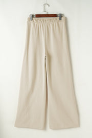 Beige wide-leg drawstring lounge pants with elastic waistband