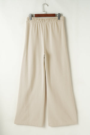 Beige wide-leg drawstring lounge pants with elastic waistband