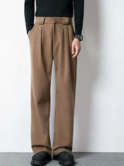 Men's dark brown wide-leg pleated dress pants with a relaxed fit.