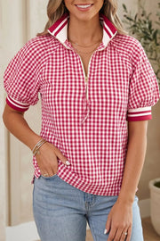 Red gingham puff sleeve shirt with zip neck and contrast cuffs.