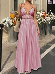 Burgundy striped halter maxi dress with plunging neckline and A-line skirt.
