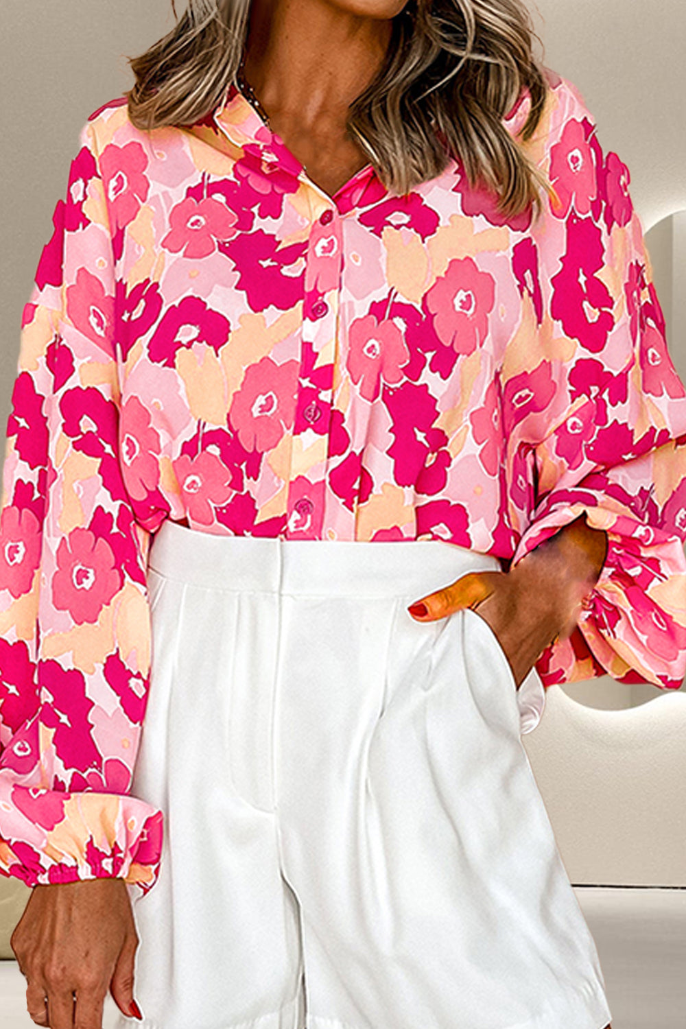 Floral print balloon sleeve blouse in strawberry pink with button front and casual cut.