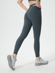 Sculpted contour leggings in dark gray with pocket detail, full length.