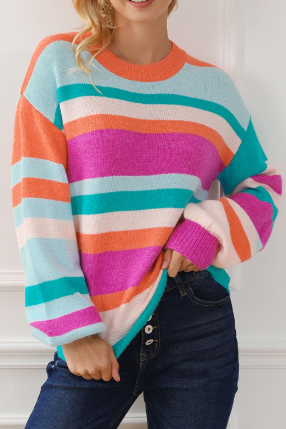 Rainbow stripe knit sweater with balloon sleeves and crew neck.