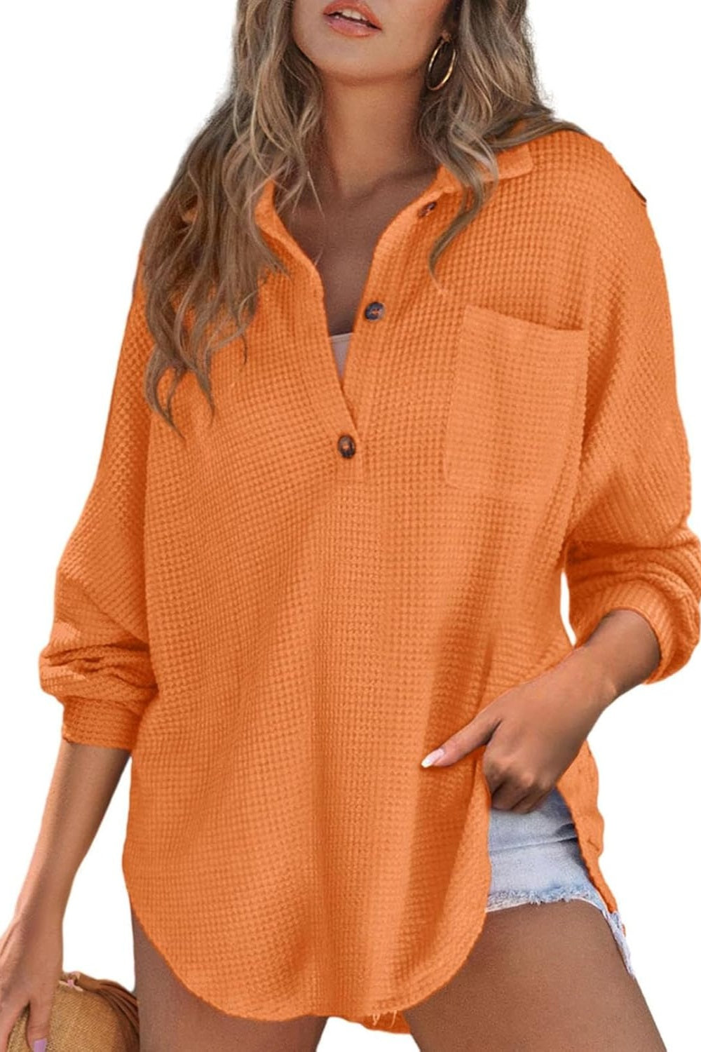 Orange waffle knit henley shirt with button placket and chest pocket