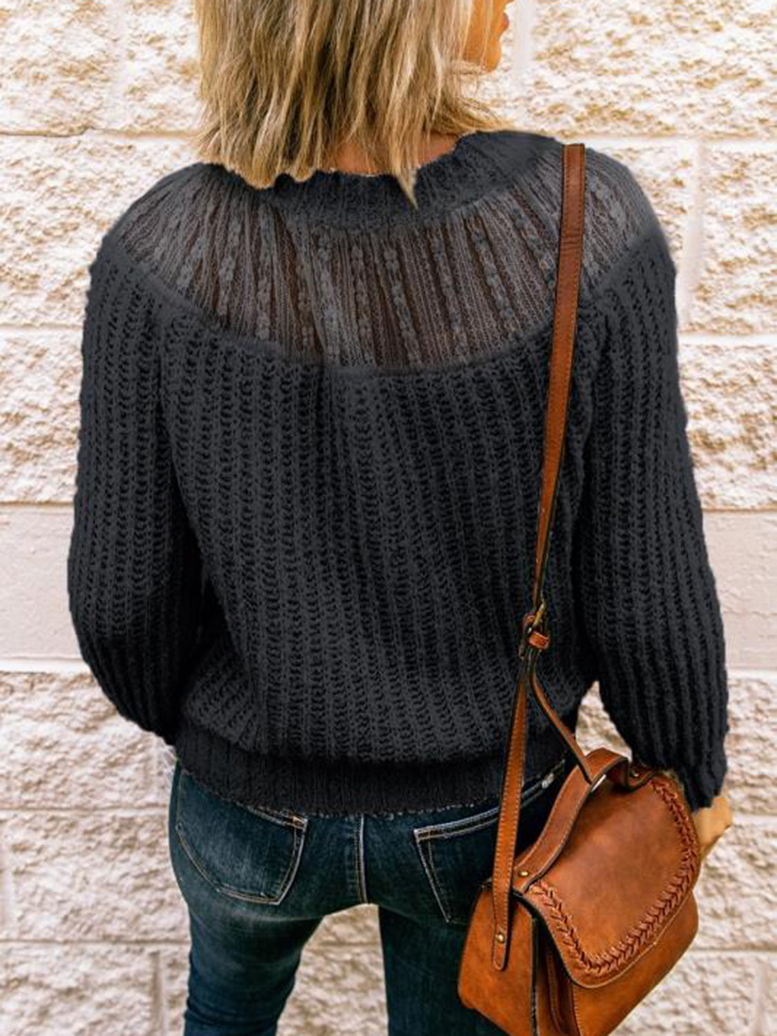 Black ribbed knit pullover sweater with sheer lace yoke detail