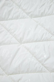 White glossy quilted puffer jacket detail with diamond stitching.
