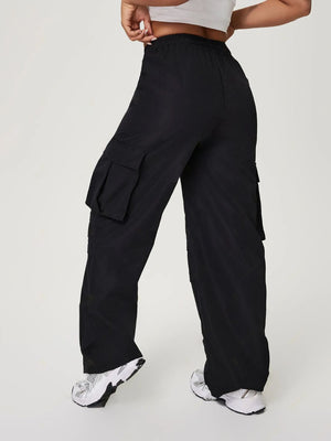Black utility cargo pants with wide legs and multiple pockets.