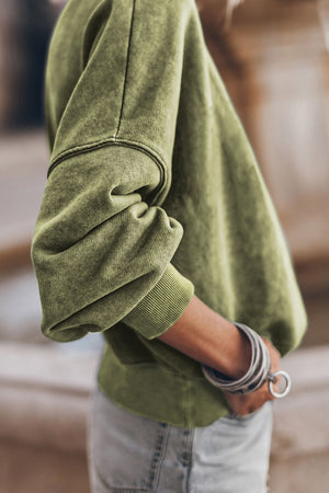 Acid wash moss sweatshirt with mock neck and ribbed cuffs.