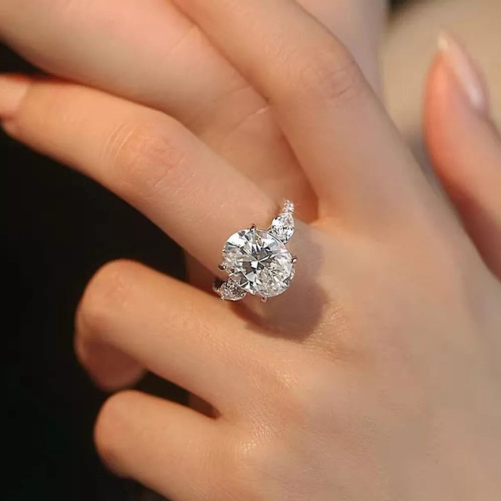 Dazzling Moissanite Oval Ring in Sterling Silver with brilliant cut stones.