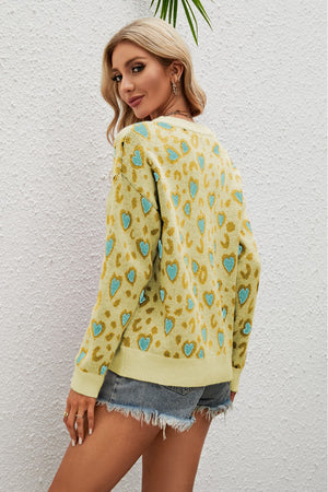 Light Yellow heart print drop shoulder sweater with leopard spots.