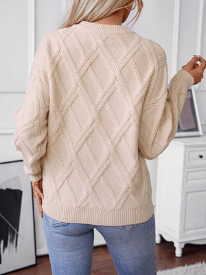 Diamond cable knit crewneck sweater in khaki with crew neckline and long sleeves.