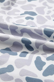 Camouflage print pajama fabric with blue and grey abstract shapes on white.