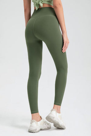 Green high rise leggings with V-seam detail on back, full length athletic pants.
