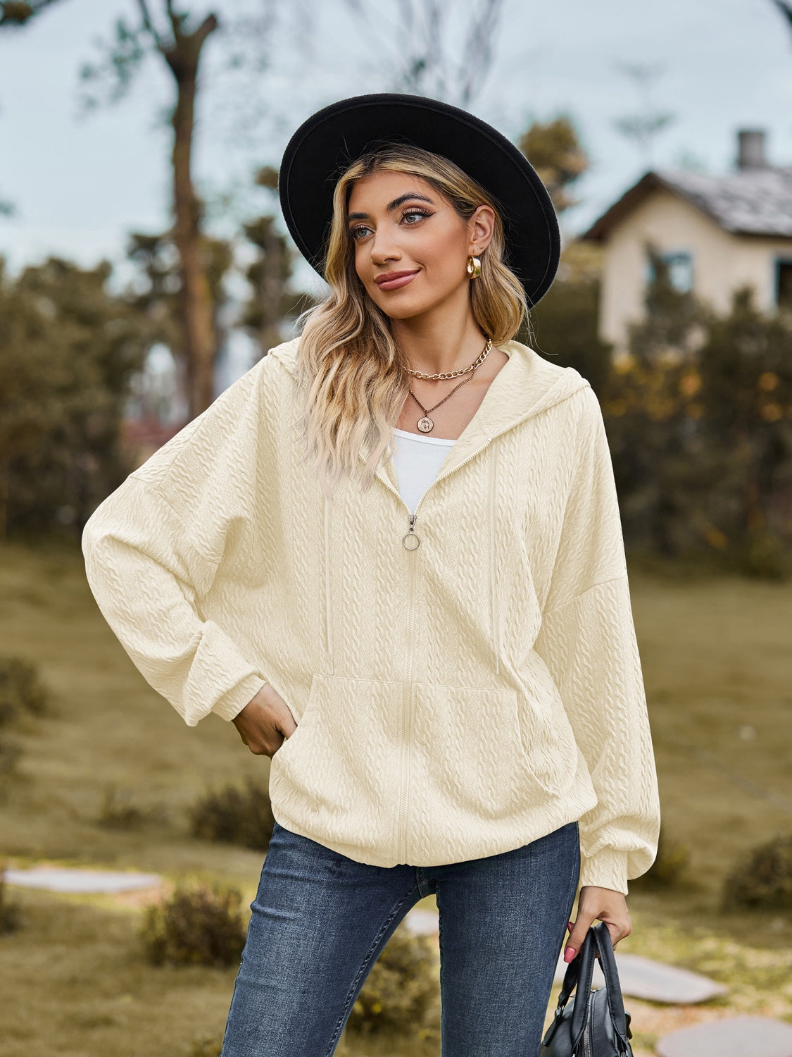 Pale blush textured knit dolman sleeve zip-up hoodie with front pocket
