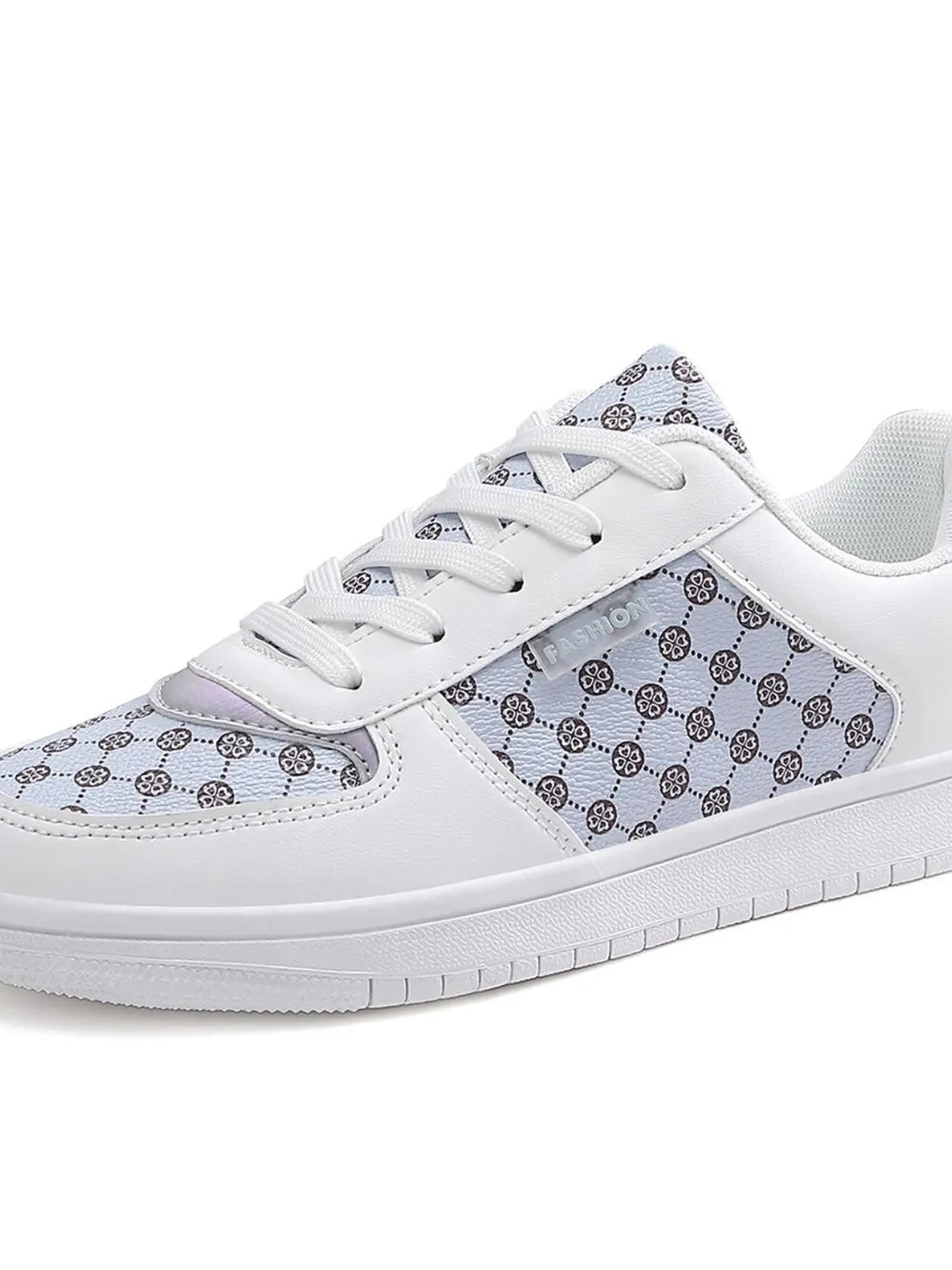 White canvas court sneakers with a patterned panel and lace-up closure.