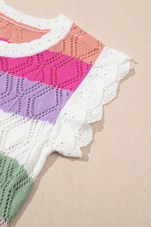 Rainbow crochet blouse with eyelet flutter sleeves and striped pattern.