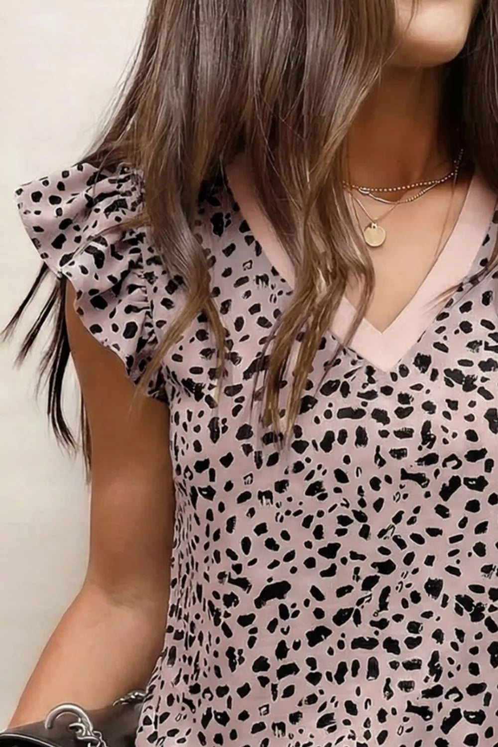 Leopard print polyester blouse with ruffled sleeves and V-neck