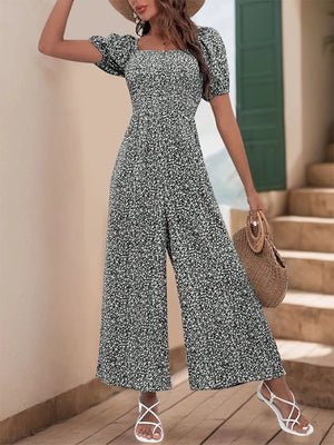 Smocked bodice floral wide-leg jumpsuit in Black White with puff sleeves and square neckline.