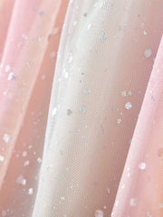 Baby dress fabric with pink and white tulle, silver glitter dots, and rainbow heart applique detail.