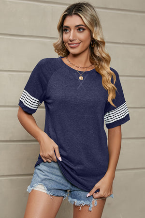 Raglan sleeve tee in dark blue with white varsity stripes on sleeves.
