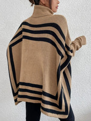 Tan geometric stripe acrylic poncho sweater with turtleneck and batwing sleeves.