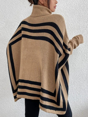 Tan geometric stripe acrylic poncho sweater with turtleneck and batwing sleeves.