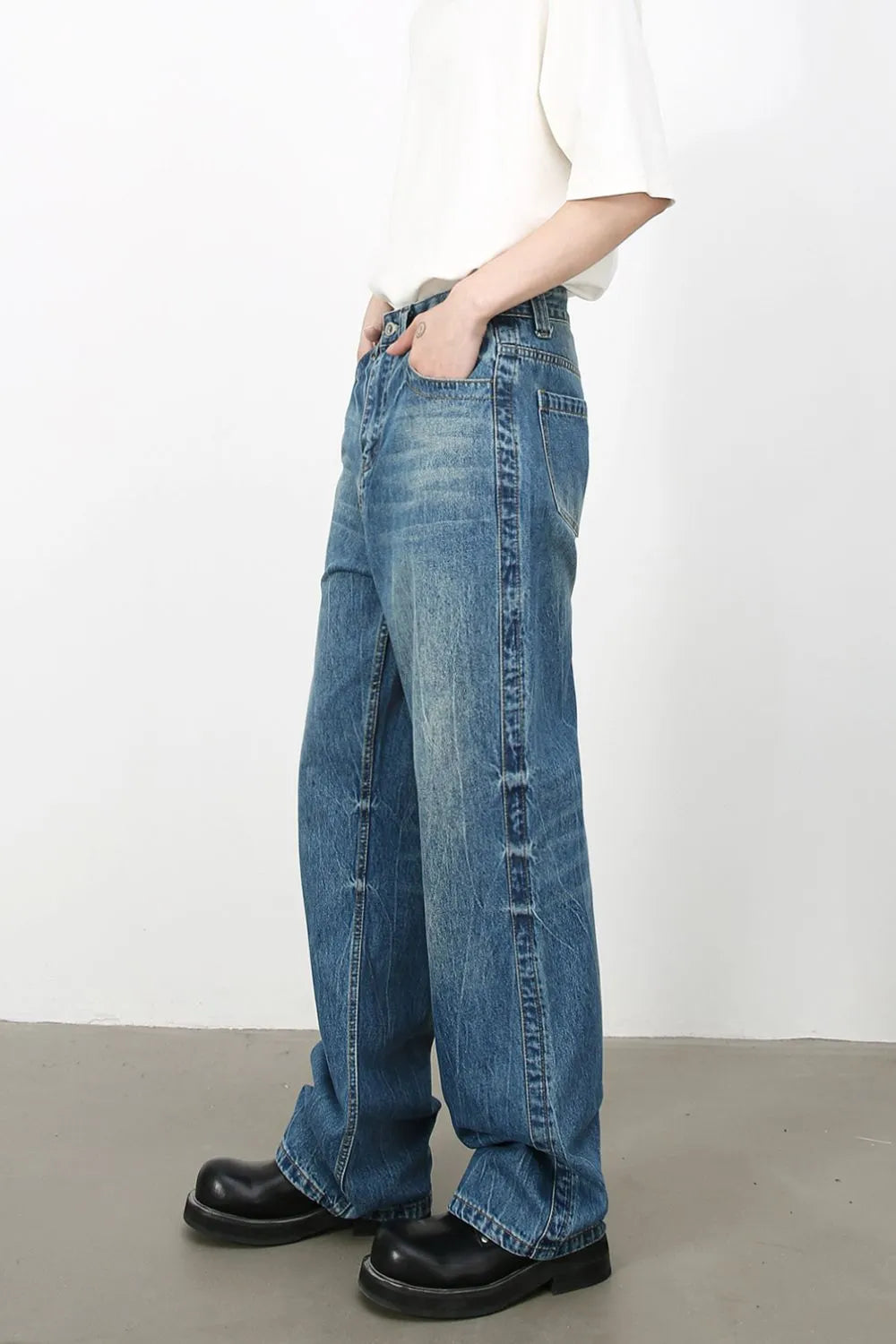 Baggy denim jeans in medium vintage wash with classic styling.