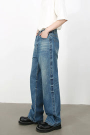 Baggy denim jeans in medium vintage wash with classic styling.