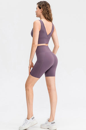 Mauve sculpted pocket bike shorts with a high waist and side pockets.