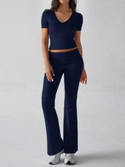 Dark blue ribbed lounge set with v-neck crop top and flare leg pants