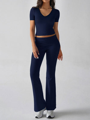 Dark blue ribbed lounge set with v-neck crop top and flare leg pants