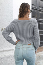 Dark gray ribbed acrylic crop sweater with blouson sleeves and a square neckline.