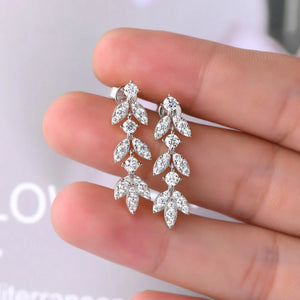 Silver cubic zirconia botanical drop earrings with leaf design