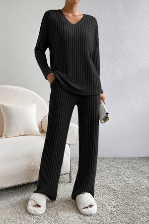 Black ribbed knit loungewear set with V-neck sweater and wide-leg pants.