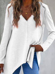 White ribbed knit tunic with V-neck and asymmetric hem
