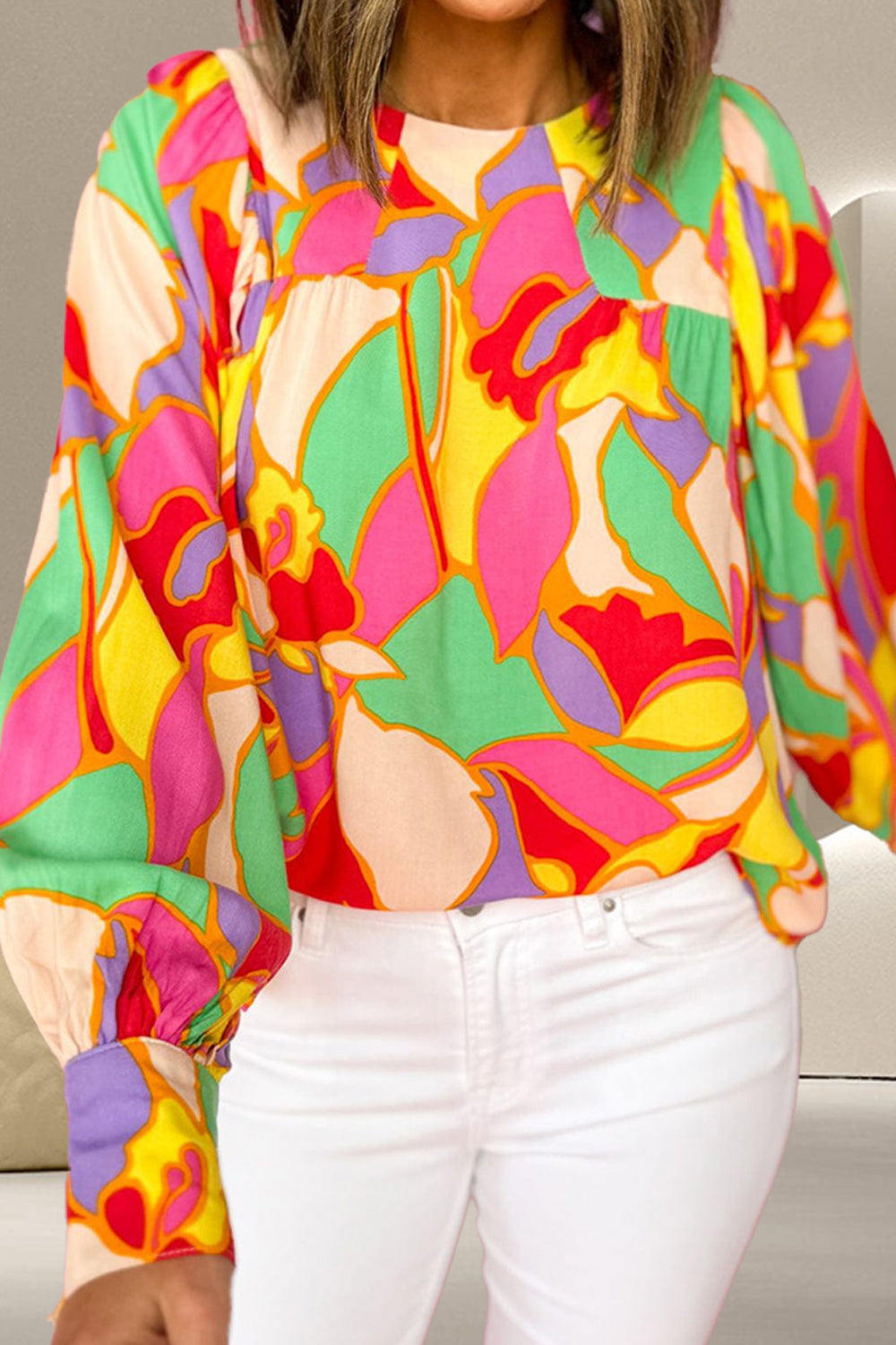 Psychedelic print gathered yoke blouse in floral with long sleeves and a relaxed fit.