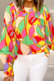 Psychedelic print gathered yoke blouse in floral with long sleeves and a relaxed fit.