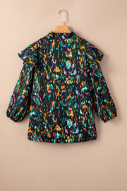 Black blouse with abstract print, ruffled aura sleeves, and mock neck.