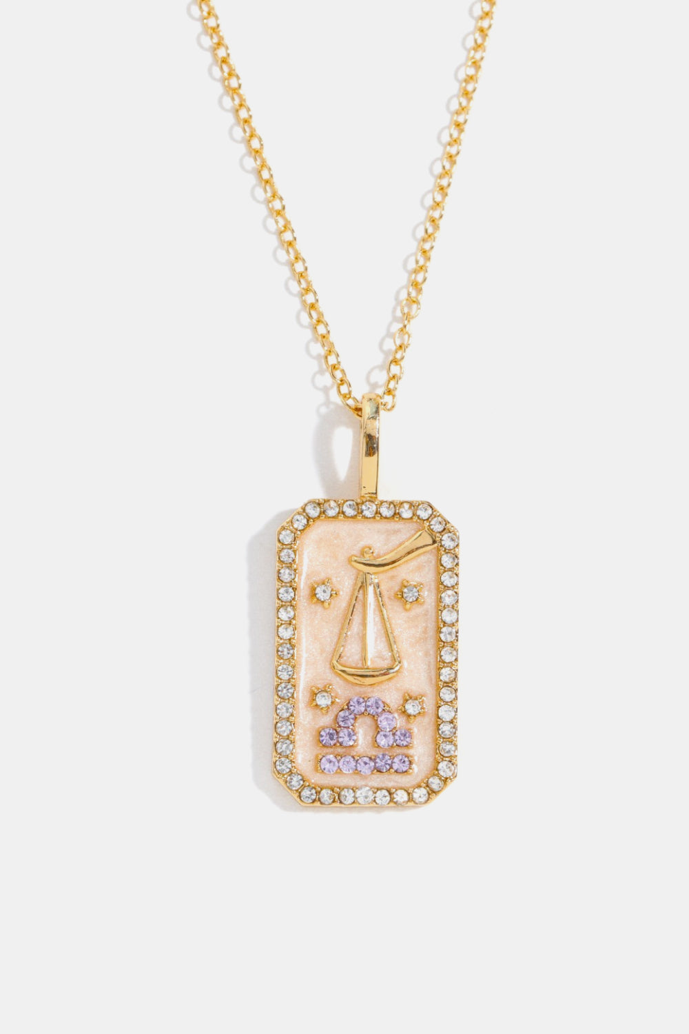 14K gold-plated Libra zodiac sign crystal pendant necklace with a rectangular pink enamel charm and clear crystal border.