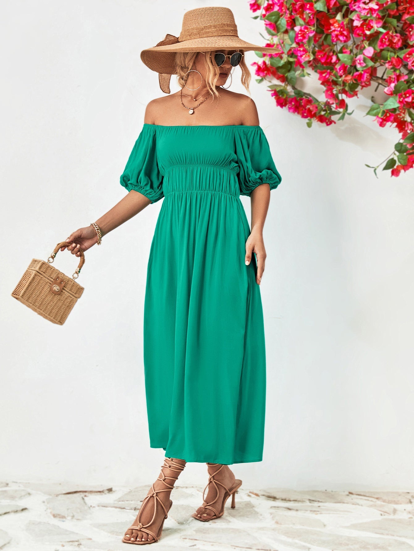Turquoise off-shoulder midi dress with gathered bodice and balloon sleeves.