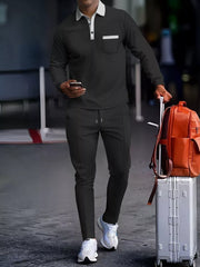 Men's black long-sleeve polo lounge set with white collar and pocket detail.