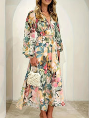 Floral print midi dress with V-neck, long sleeves, and cinched waist.