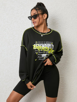 Black graphic sweatshirt with contrast stitching and text detail.