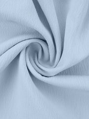 Light blue polyester pajama fabric with a ruffled texture.
