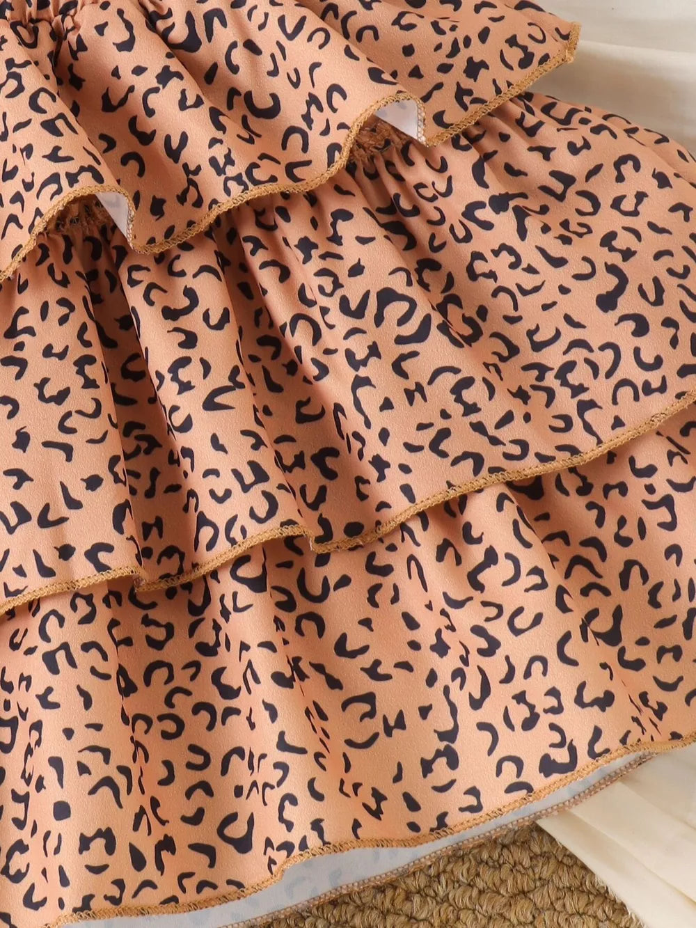 Children's Halter Top & Leopard Ruffled Skirt Set in Black, model styling view
