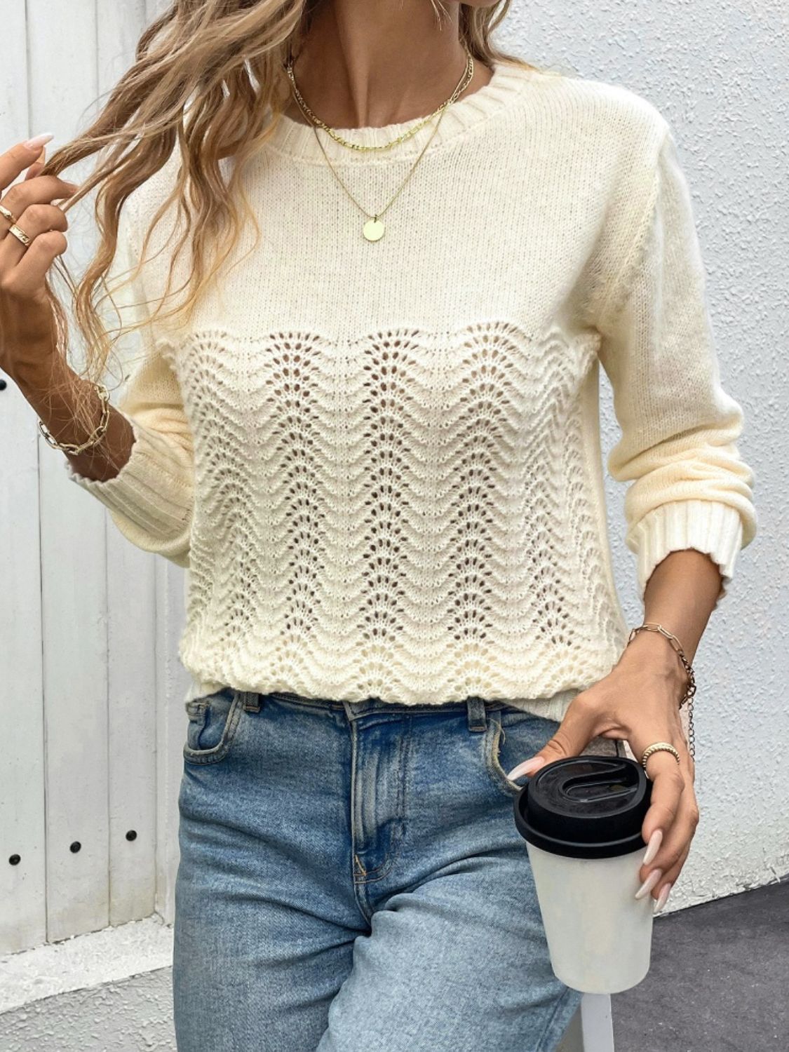 Cream crewneck sweater with lace inset detail and long sleeves.