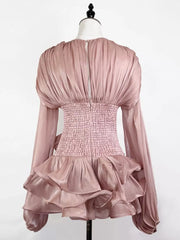 Pink ruffled mini dress with ruched corset waist and long sleeves