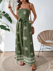 Bandeau jumpsuit in matcha green with white embroidery and wide legs.