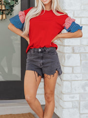 Ruffled patriotic graphic maternity t-shirt with red body and American flag print sleeves.